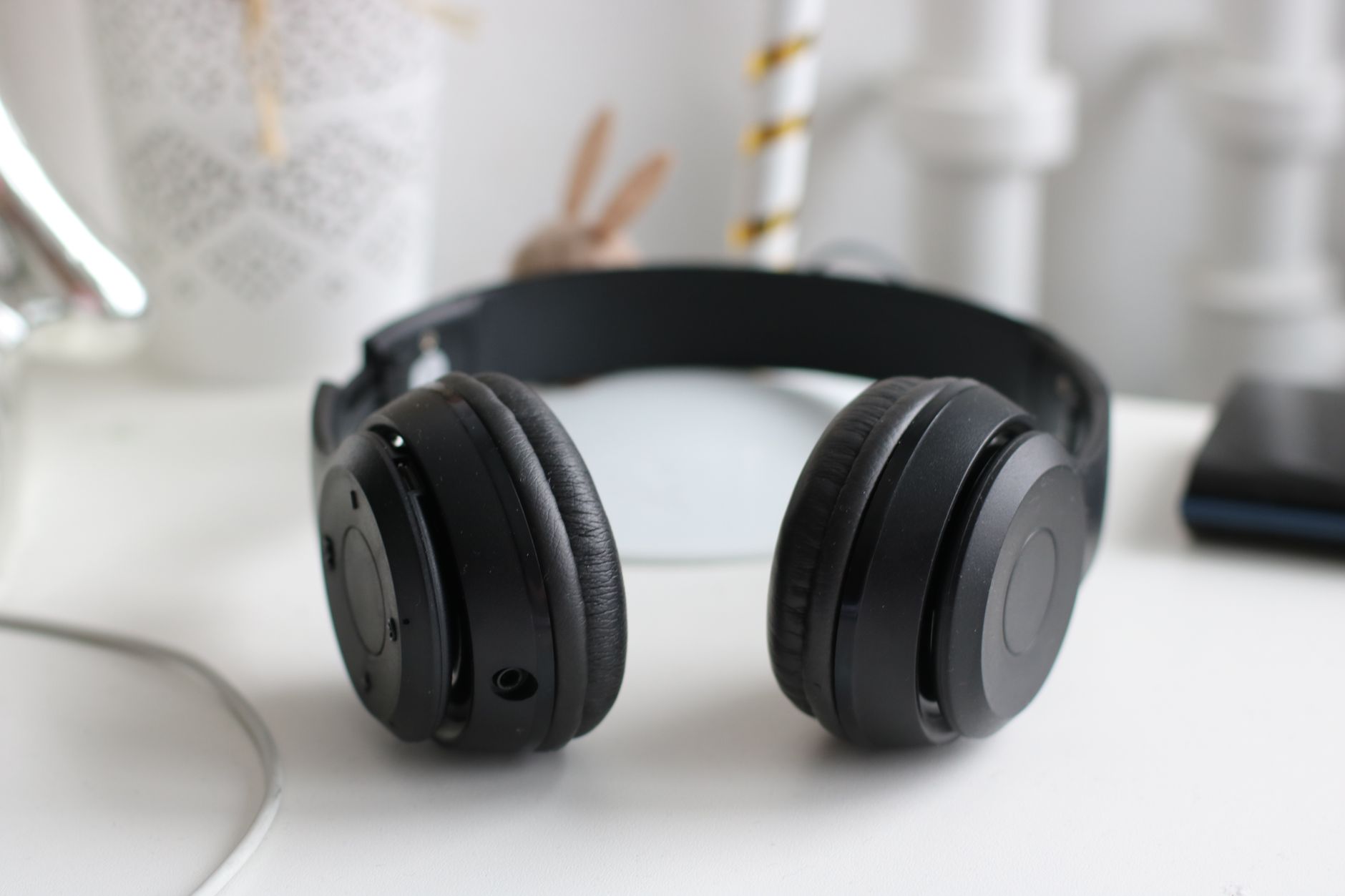 Noise-cancelling headphones on a minimal desk